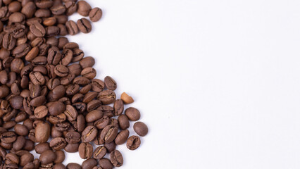medium rare brown arabica coffee beans lie on a white background for text