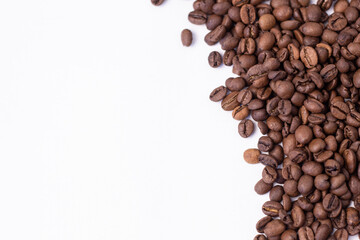 medium rare brown arabica coffee beans lie on a white background for text