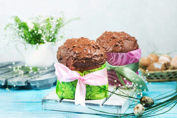 Easter cakes. Painted eggs. Easter background. Spring still life. Panettone with chocolate. 
