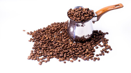 fragrant beans from the coffee tree in medium roast lie on a white background with space for text in an iron coffee maker with a brown handle