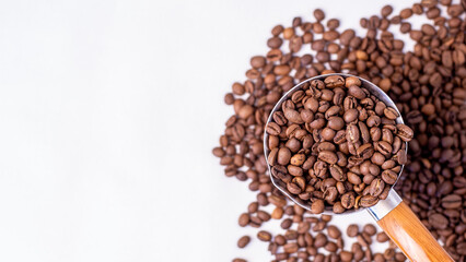 medium roast coffee beans lie on a white background