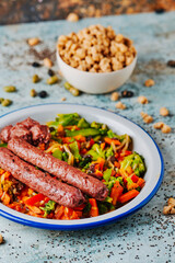 veggie sausages served with grilled vegetables
