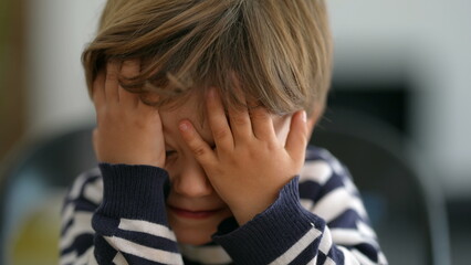 Little boy reaction OH NO covering face with hands