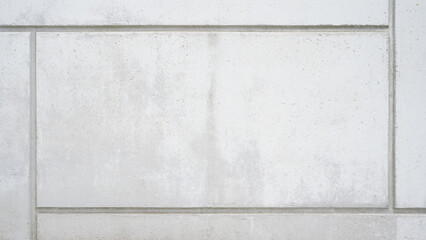 White gray grey stone concrete cement wall facade from a building texture background