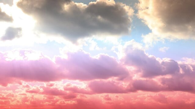 pink and blue sky and white heap cloud moving time lapse. Beautiful Universally Cloudscape background. rolling puffy white clouds are moving with blue sky in background.