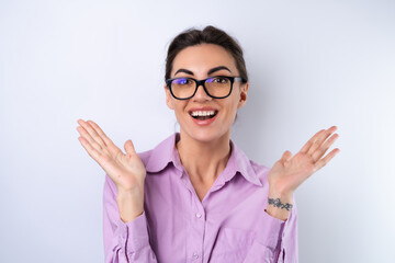 Young woman in a lilac shirt on a white background in glasses for vision cheerful positive in a...