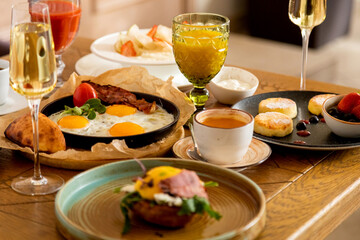 breakfast table with a variety of dishes and drinks