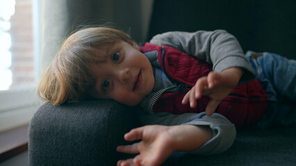 Cute child pushing camera away toddler wanting to touch lens