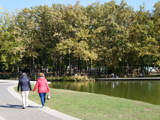 People in the park at autumn time