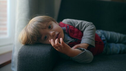 Obraz premium Toddler child lying on couch sofa
