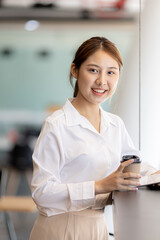 Beautiful Asian woman is a businesswoman who leads a new generation of startups, a woman who runs and manages a business plan to build confidence and stability in business, woman-led business concept.