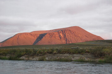 Lonely mountain in the Polar Urals at sunset.