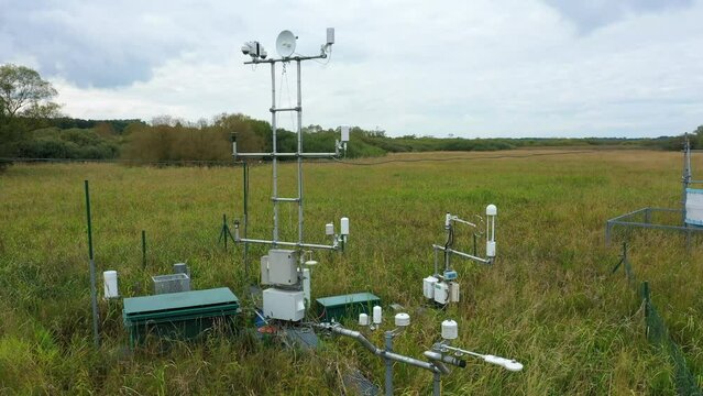 Wetlands science station research for studying meadows, drone aerial video shot ecosystem weather station swamp willows cycle carbon flux eddy covariance methane research physiological photosynthesis