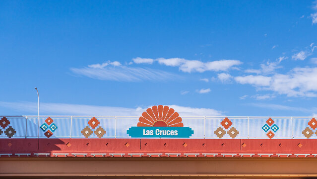 Las Cruces, New Mexico - Oct. 11, 2021: Highway overpass in Las Cruces with name and southwestern design.