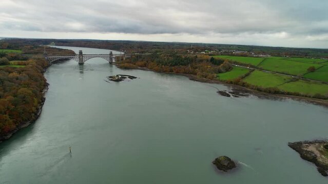 Impress aerial shot of the suspension bridge that crosses the Menai Strait between the island of Anglesey and the mainland of Wales