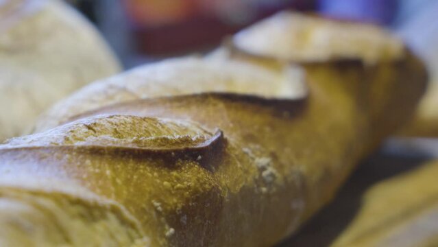 Freshly baked baguette in France close up camera movement on a slider