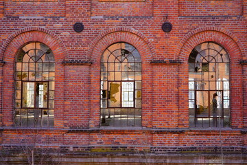 Old red brick factory, old architecture of the city of Lodz, Poland. Abandoned factory 