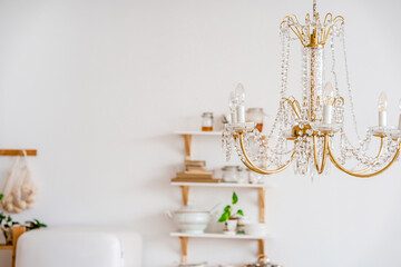 Details of a luxurious crystal chandelier in a bright interior