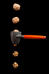 walnuts and nutcracker with black background