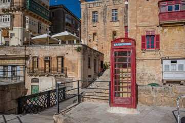 Fototapeta na wymiar Red telephone booth in Valletta, Malta.
