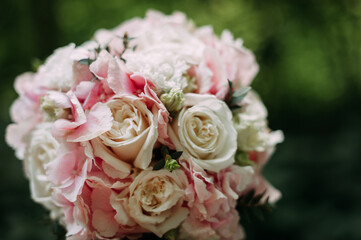 Pink bouquet on the background of a green forest 4027.
