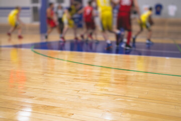 View of basketball court hall indoor venue with junior teenage school team playing in the...