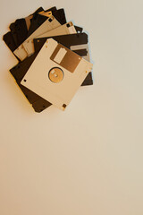 Vintage image of a stack of floppy disks in plastic cases for a computer as a way to store...