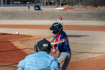 Baseball Player Takes a Swing at the Ball