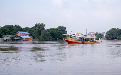 The boat was sailing in the river