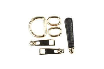 Metal Buckles and zippers for Bag isolated on white background. Tailors sewing accessories. Isolated golden buckles. Clothing fasteners template.