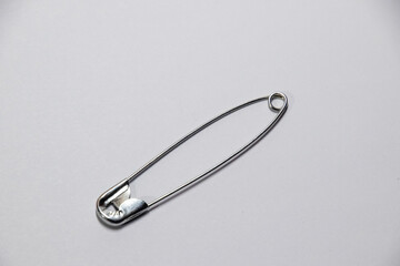 Pin on white background. pin for fastening clothes.