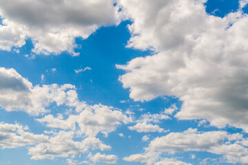 Naklejka na ściany i meble Blue sky with clouds as a background. Clouds receding into the distance.