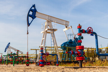 Oil and gas industry in Russia. Oil pumping chair in the fields of Siberia.