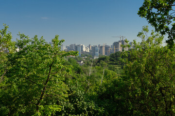 City next to the forest. Construction of residential buildings near the forest