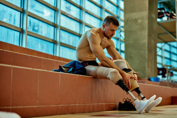 Determined men preparing for a swim