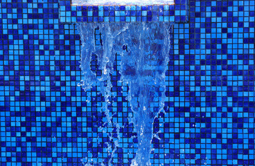 Blue water fountain displayed outdoors.