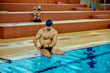 Pralympics male swimmer preparing for training