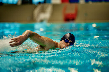 Caucasian male swimmer in the pool