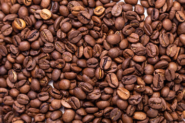 Fototapeta premium texture fragrant beans for morning coffee on a white background