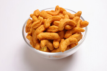 Deep fried battered onion pakoda slightly curly crispy spicy ready to eat snack