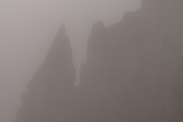 Magical view of the top of Spitz mountain in the Carpathian Mountains, Spitz mountain in the fog, mystical and scary.