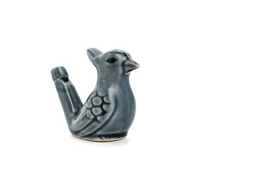 Porcelain whistle form bird, children toy on white background.