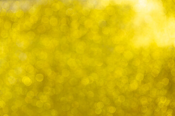 Yellow blur background,Gold glittering background,A soft glowing golden yellow bokeh background in...
