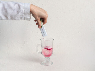 Glass of natural berry collagen protein powder in glass of water for skin regeneration. Food...