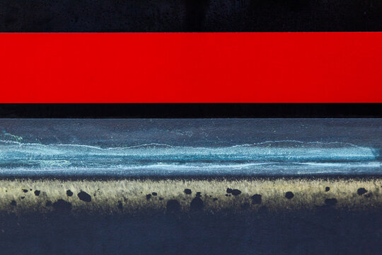 Part of the hull at the level of the waterline, close-up.