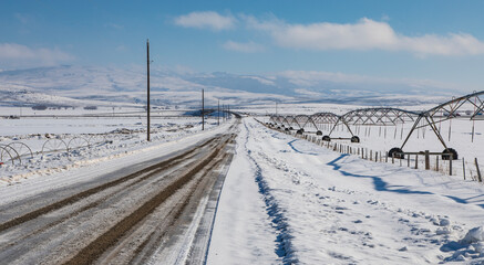 Snowy road in the farmlands of Idaho
