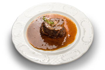 Beef braised in red wine in white dish isolated on white