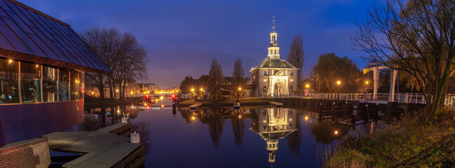 The old city gate Zijlpoort in Leiden at sunrise.