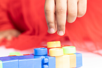 Nimble fingers Of Infant Toddler Kid Playing With Multicolored Building Blocks. Fun, Activity, Pre School, Educational, Kindergarten, Learning, Home Activity, School, Nursery, Daycare Concept