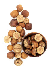 Sichuan china berry fruit herb used in traditional Chinese herbal plant  medicine on white background. Used to treat ringworm and parasitic roundworm. Chuan lian zi. Fructus toosenden.